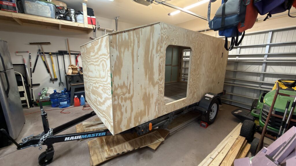 Camper exterior sheathing and insulation installation