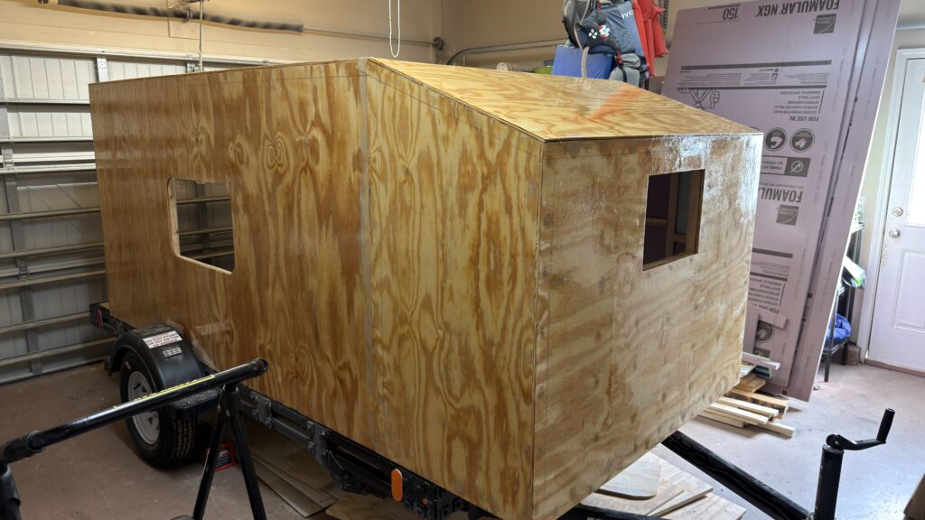 DIY camper fiberglassing on a homemade camper